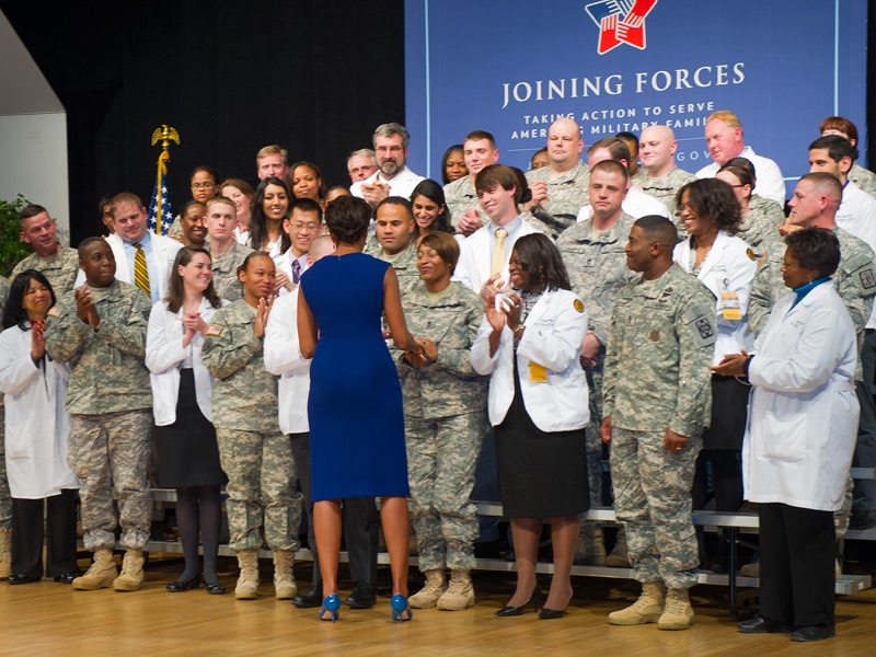 Michelle Obama shaking hands with members of the military and VCU School of Medicine staff