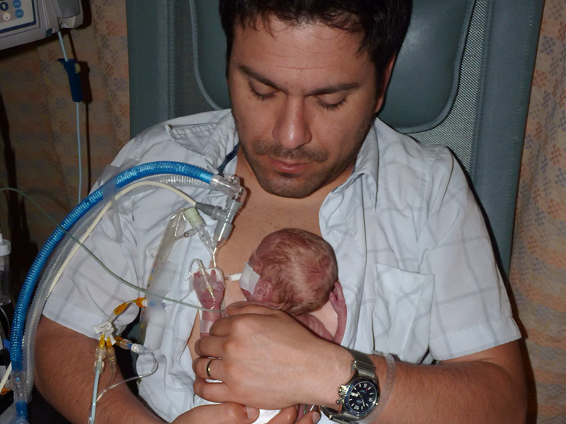 Paula's husband, Ivan, holding baby Santiago in April 2012