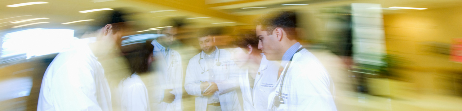 Group of people in a blurred hospital setting