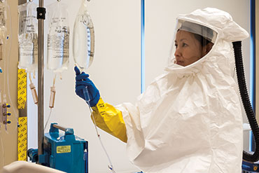 A Medical professional wearing protective clothing