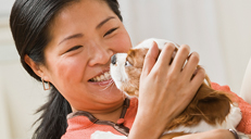 Woman holding dog