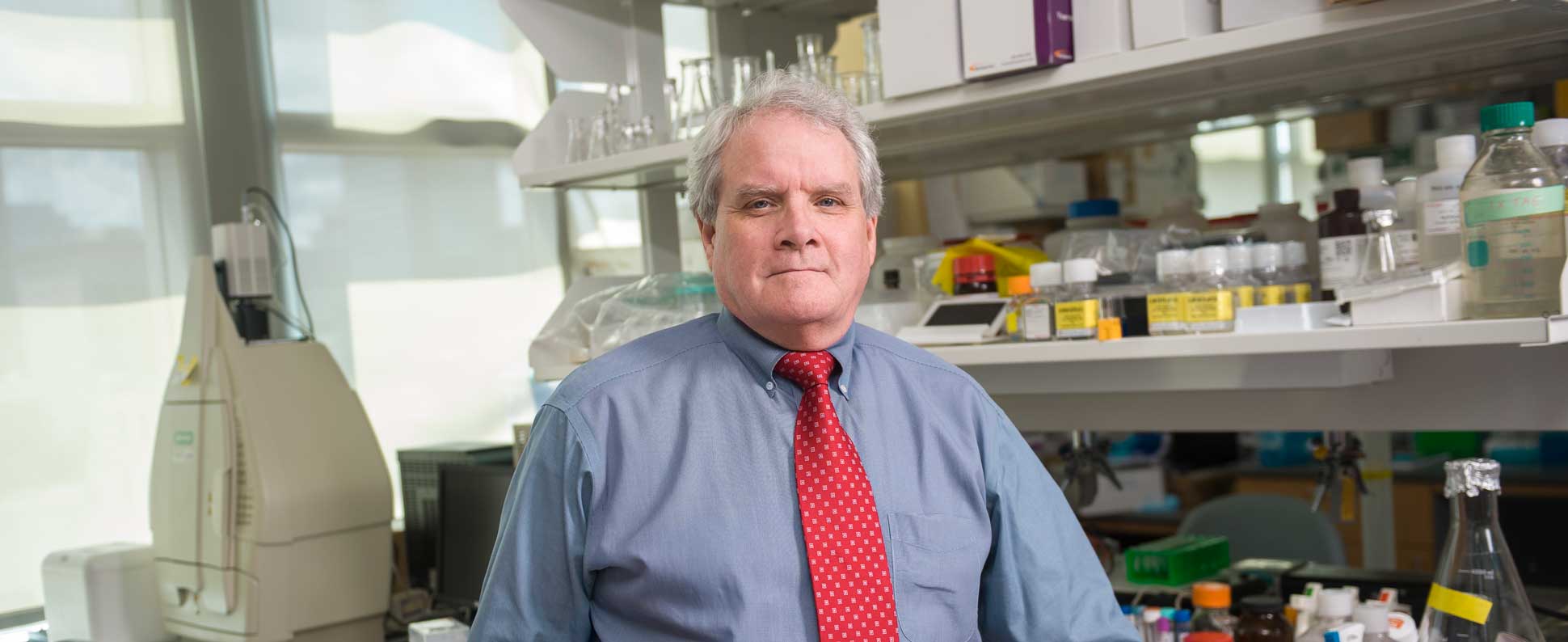 Alpha A. (Berry) Fowler III, M.D. poses for portrait in his lab