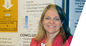 Kimberly Nelson, DNP, posing in front of posters of her research