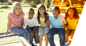 Five children on a playground ride