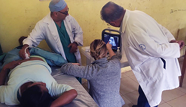 Female Cassie Valukas reads an ultrasound during a Cinterandes mobile surgery trip to Ecuador.