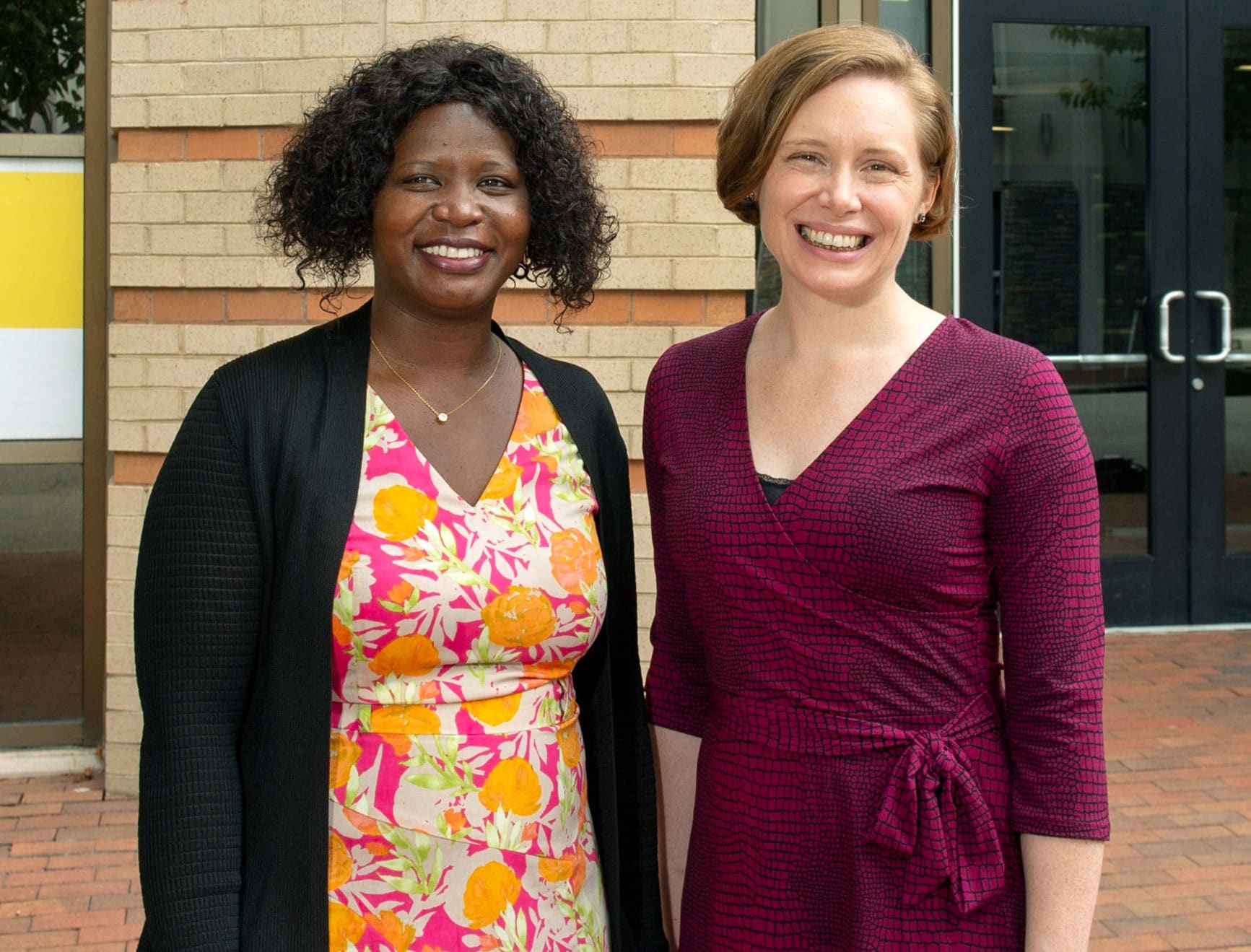 Phoebe Dacha, M.D., and Caitlin Martin, M.D., outside the MOTIVATE Clinic in the Jackson Ward neighborhood of Richmond.